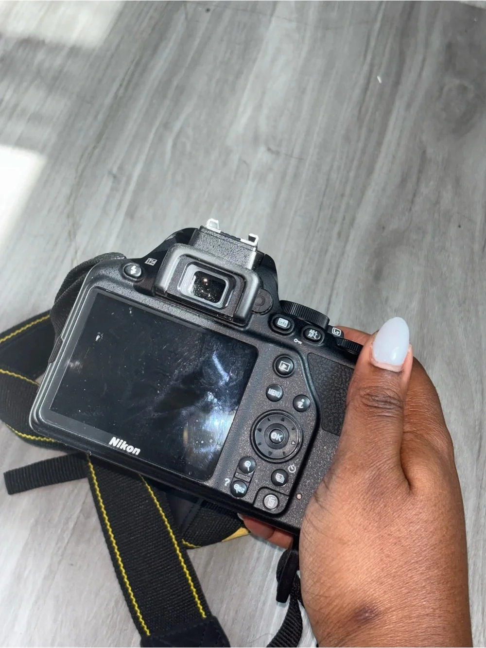 Nikon D3500 Black DSLR Camera with Black Zoom Lens and Red Accent